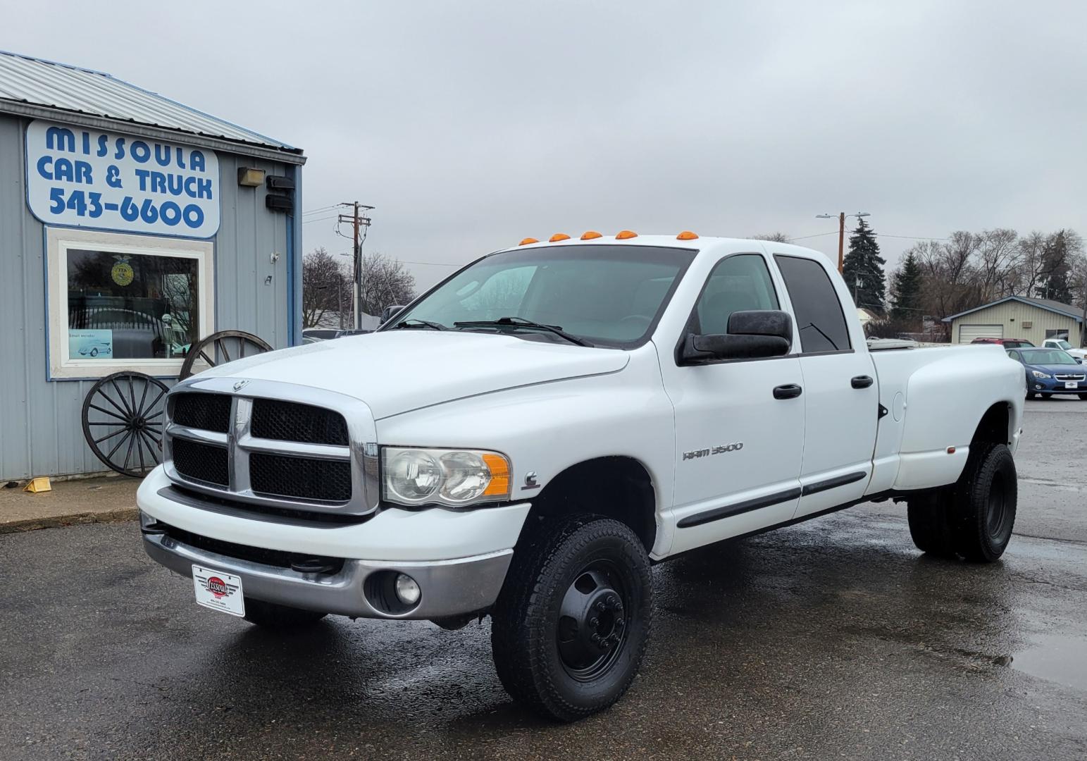 2005 White /Black Dodge Ram 3500 SLT (3D7LS38C85G) with an 5.9L I6 24V Cummins engine, 6 Speed Manual transmission, located at 450 N Russell, Missoula, MT, 59801, (406) 543-6600, 46.874496, -114.017433 - 4 Wheel Drive. One Ton Dually. Long Box. 6 Speed Manual Transmission. Has a lot of miles but runs amazingly. Air Cruise. Tilt. Power Windows and Locks. Power Drivers Seat. AM FM CD XM. 1 Owner. Clean Carfax. There is no financing options on this vehicle. - Photo#1